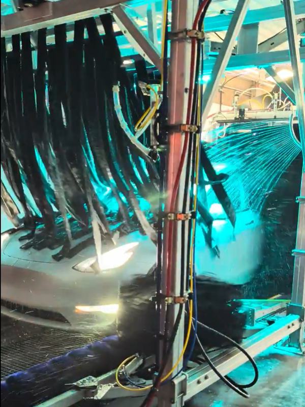 A car moving through the brushes inside the Mr. D tunnel