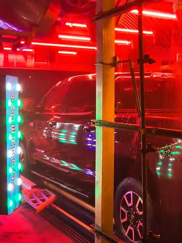 A lit Underbody arch spraying the underside of a pickup truck
