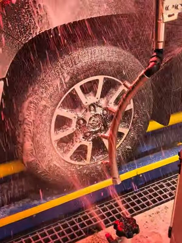 Wheel and tire scrub spraying a truck tire